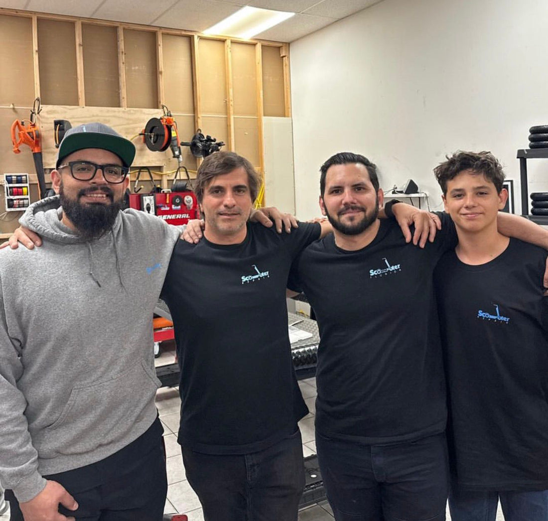Scooter Repair Florida workshop team with tires and repair equipment